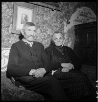 [Elderly couple in war-damaged village home: Emile Schmidt and wife in Ammerschwihr?]