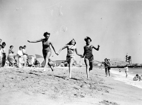 Three women running on Venice Beach
