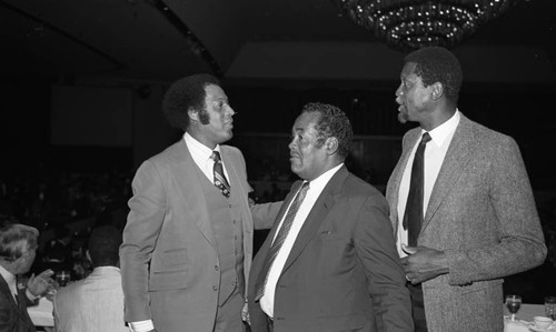 Elgin Baylor and Bill Russell talking together at the NBA All-Star dinner, 1983
