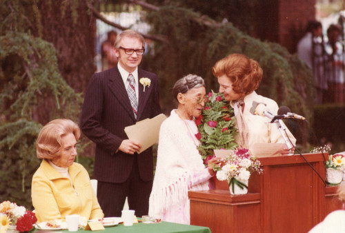 Betty Ford congratulating Pearl Williams during foster grandparents ceremony, 1975
