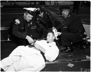 Priest injured in traffic accident at Wilton Place and Pico Boulevard, 1958