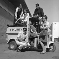 Students on security vehicle