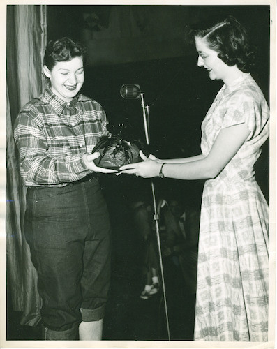 Ruby Young presenting a ham to the ticket winner