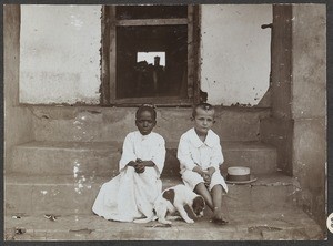 African and European boy with a dog, Tanzania, ca.1900-1914
