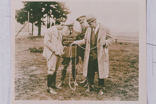 Will Rogers demonstrates rope tricks to onlookers