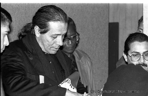 Edward James Olmos signs autograph