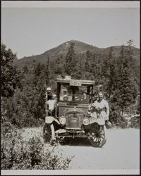 Dora Evans and children in the Evans company truck stopped on country road, Sonoma County, California, about 1930