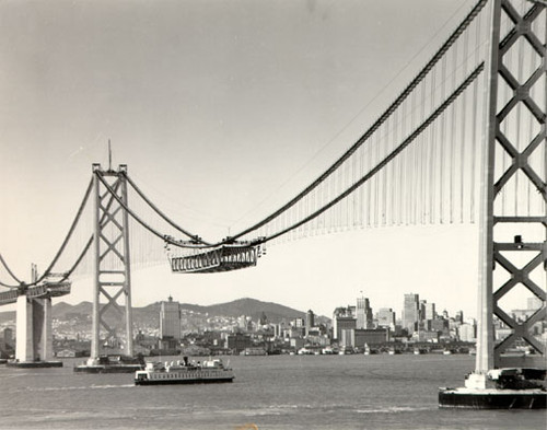 [View of the San Francisco-Oakland Bay Bridge while under construction]