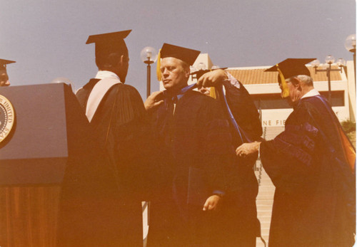 President Fords receiving honorary degree during Firestone Fieldhouse dedication, 1975