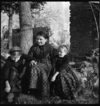 Alsatian family. Three little girls on road