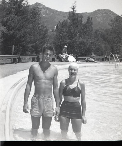 Man and woman at Lake Enchanto swimming pool
