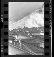 Residents watering down roofs as brushfire approaches in Hacienda Heights, Calif., 1978