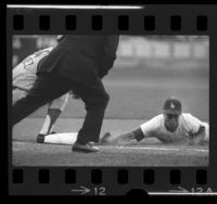 Maury Wills sliding into first base during Los Angeles Dodgers game in 1965