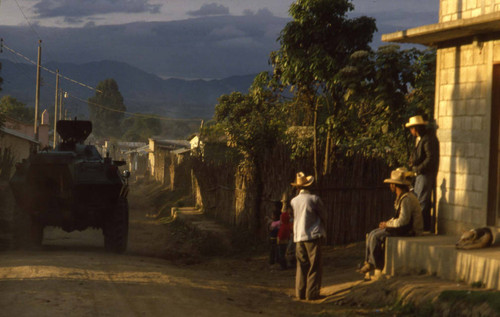Soldiers patrol the streets of Zaragoza in military tanks, Chimaltenango, 1982