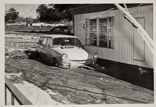 Car immersed in mud in Beaumont flood of 1969