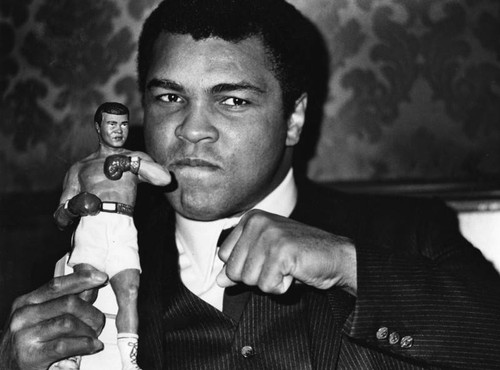 Ali poses with replica
