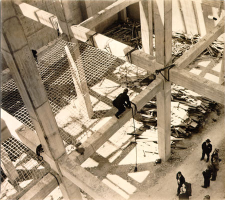 [Bridge worker securing a safety net during construction of the San Francisco-Oakland Bay Bridge]