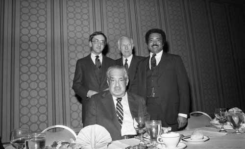 Justice Thurgood Marshall posing with others at a USC Legion Lex dinner, Los Angeles, 1983