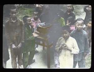 Boys listening to a record player, China, ca. 1920-1940