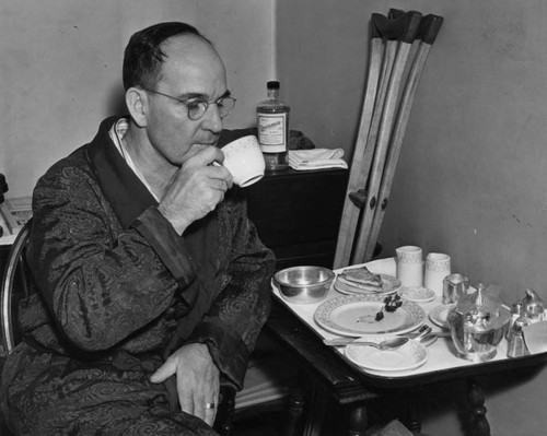 Harry Raymond having breakfast