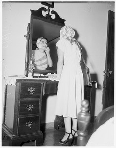 Boy poses as girl to visit mother, 1951