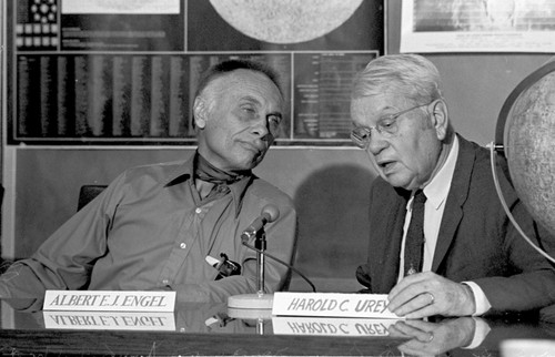 Sitting at the UCSD Moon Rock research press conference table; Albert E.J. Engle (left) UCSD Professor in the Earth Sciences department and Harold Clayton Urey (right) UCSD Chemistry professor and Nobel Prize winner in chemistry (1934) for his "discovery of heavy hydrogen" at a press conference table. January 19, 1971