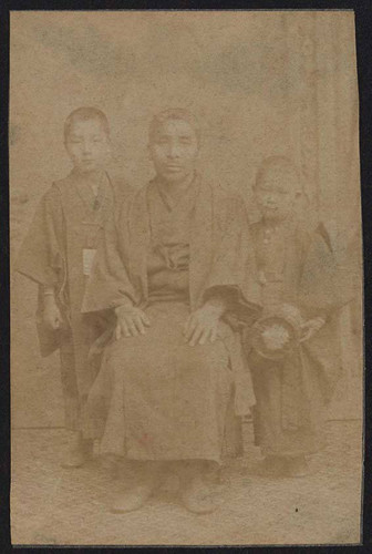 Man and two boys in kimonos