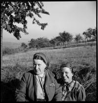 [Ammerschwihr: TB Village. Thérèse Bonney and a woman with field behind.]