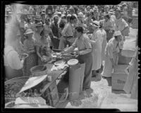 Sheriff Gene Biscailuz serving food at the Sheriff Barbecue, Los Angeles, 1935