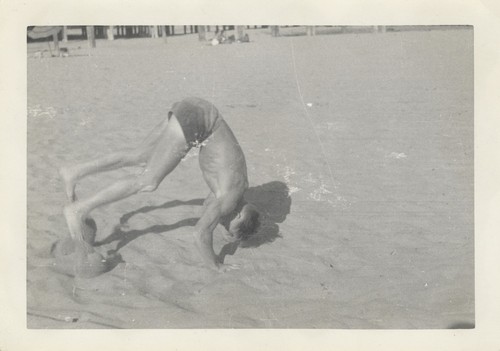 Bob McCullah doing handstand at Cowell Beach