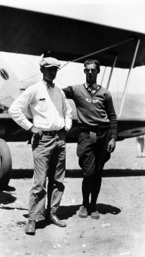 Two men in front of airplane at Martin's airfield, Santa Ana, ca. 1930