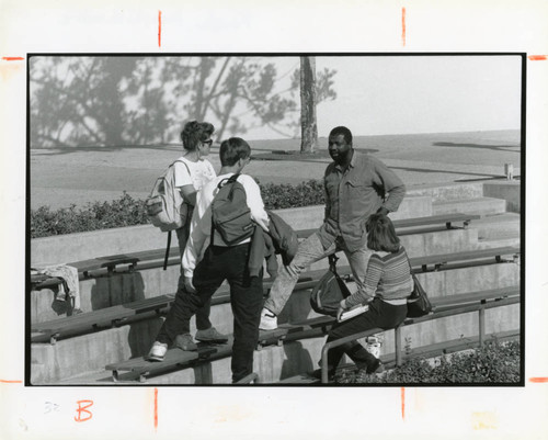 Photograph of four students in the Fouch Amphiteatre