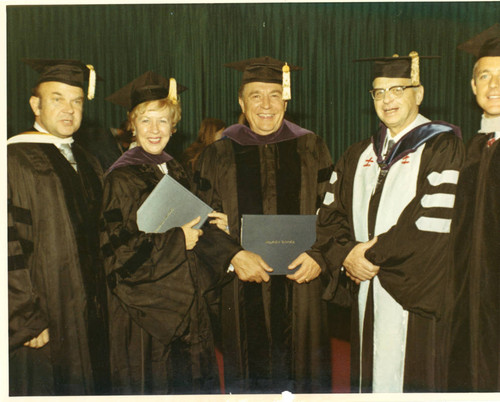 President Young, an unknown lady honorary doctorate recipient, and unknown men, Chancellor Banowsky