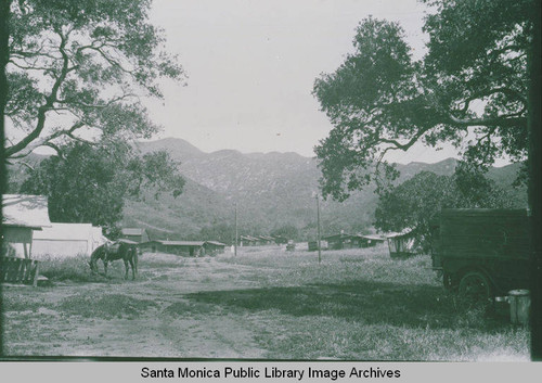 Early settlement of Founder's Oak Island in Temescal Canyon showing tents and a grazing horse
