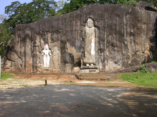Sculptured rock; standing Buddhist images: Mahāyāna tradition