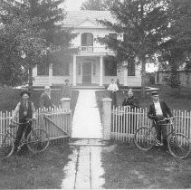 Group of people outside two with bicycles