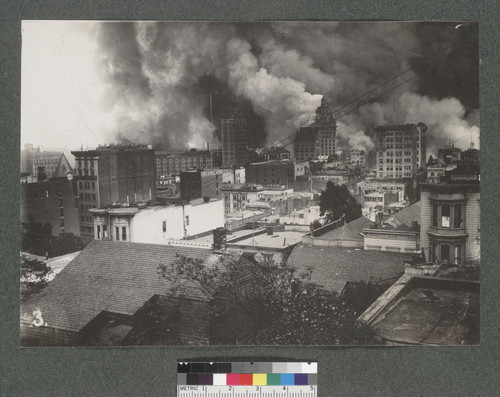 [View from southeast slope of Nob Hill of fire burning, South of Market district. Spire of California Hotel and Theatre, far left; Call Building on fire, right center.]