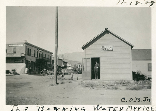 The Banning Water Company building on South San Gorgonio Avenue with C. O. Barker standing in doorway
