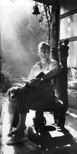 Walter Munk, seated, with dog