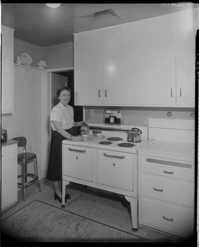 Lady cooking with electric range