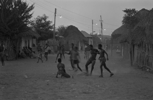 Boys playing soccer in the street, San Basilio de Palenque, ca. 1978