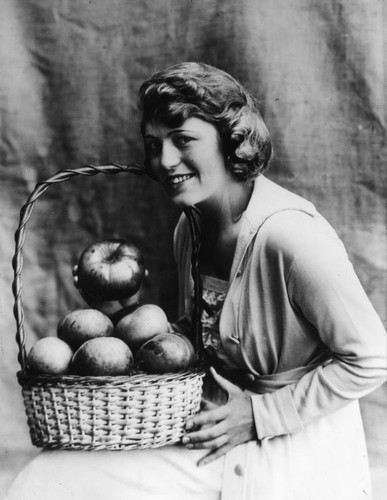 Woman with apple basket