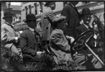 Six men in old car, possibly parade