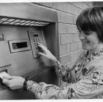 Customer using ATM at Sumitomo Bank