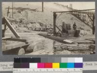Drag saw (catamaran to left) in pond of Spanish Peak Lumber Company, Quincy, California. August, 1920. E.F