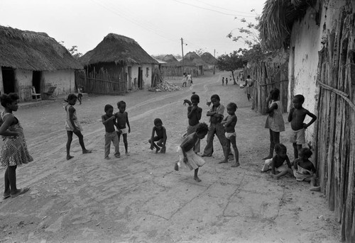 Children playing hopscotch on the street, San Basilio de Palenque, 1977