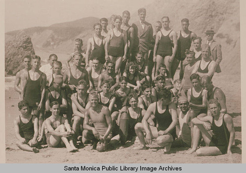 Swimmers on the beach near the site of Castle Rock and Pacific Palisades, Calif