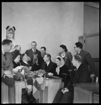 Reims: [Pierre Schneiter with men and women in an office]