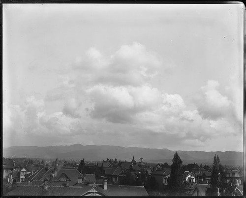 Clouds and bird's-eye view of residential section, Oakland. [negative]