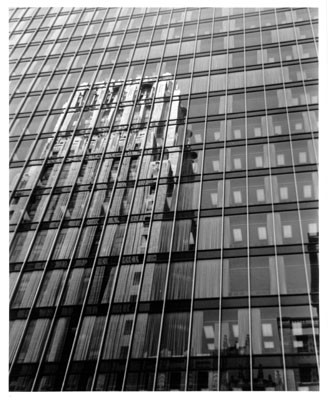 [Reflection of Shell Oil Building on side of neighboring building]